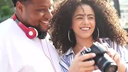 Photographer showing a picture to her boyfriend Stock Footage