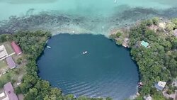 Aerial view of boats at Bacalar Lagoon in Mexico Stock Footage