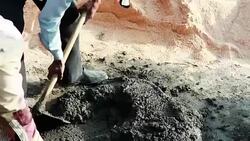 Worker mixing cement on construction site. Stock Footage