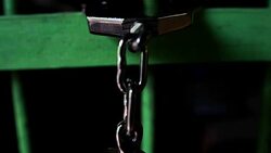 Slow Motion: Shackle hook stuck in the dark jail Stock Footage