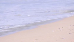 Close-up footage of waves crashing against Atlanterra Beach News Clip