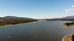 Aerial Shot Flying Over Big Bear Lake with Beautiful Blue Skies in View Stock Footage