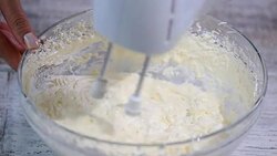 Making of a cream for home-made cakes. Beat with a mixer butter cream. Stock Footage