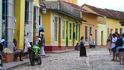 Trinidad, Cuba: city life on an old cobblestone colonial street Stock Footage