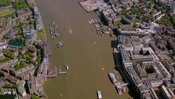 Aerial View of Tower Bridge and Canary Wharf, London, UK. 4K Stock Footage