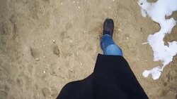 Vintage footage man walks on snow and sand - Stock Video Stock Footage