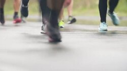Running in bad weather conditions Stock Footage