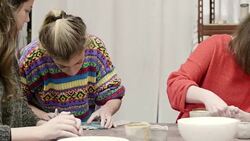Teacher cutting clay by students in studio Stock Footage