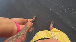 Couple holding hands at Seminyak beach in Bali Stock Footage