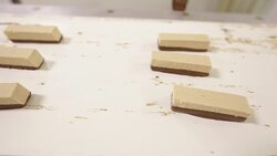 Candy on a Conveyer Belt with Chocolate Coating Stock Footage