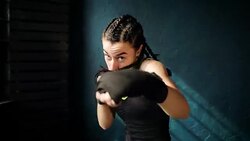 beautiful young moving boxing woman training punching in fitness studio Stock Footage