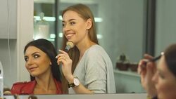 Beautiful girl does a hairstyle in a beauty salon Stock Footage