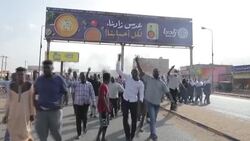 CLEAN : Anti-military protestors block roads and gather in streets of Khartoum News Clip