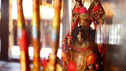 Buddhist traditional statues of chinese sacred gods on the altar inside the temple Stock Footage