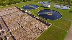 Aerial view to sewage treatment plant. Grey water recycling. Waste management theme. Stock Footage