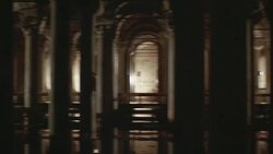 PAN LEFT TO RIGHT OF UNDERGROUND TEMPLE OR MOSQUE. STONE PILLARS WITH ORNATELY CARVED ARCHES STAND WITHIN REFLECTION POOL. WATER. R WALK WAYS. COULD BE MAUSOLEUM. Stock Footage
