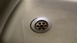 Close up of kitchen sink drain with water drop - Stock video... Stock Footage