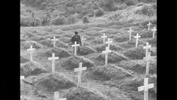 A Korean man visits a Korean War gravesite News Clip