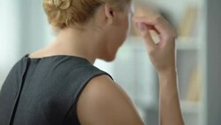 Overworked woman feeling strong shoulder pain, nerve inflammation, back view Stock Footage