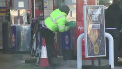 Worker disinfecting fuel pumps during coronavirus lockdown News Clip