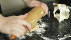 male hand roll the dough out with the wooden rolling pin Stock Footage