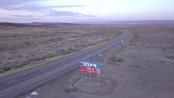 Aerial Drone Footage of Semi-Trucks Passing Utah State Line Stock Footage