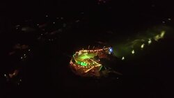 Night time aerial view of party social scene held at a cable wakeboarding park at Kite Cable Thailand, Pranburi Stock Footage