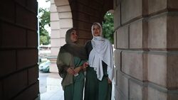Gorgeous Arabic students spending their leisure time by having a walk Stock Footage