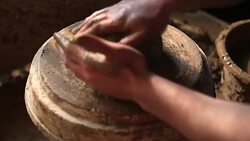 Creating an earthen jar on the circle Stock Footage