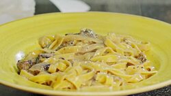 Slow motion of fettuccine with alfredo mushroom sauce Stock Footage