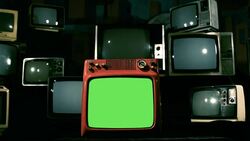 Old Television With Green Screen In The Middle Of Many 80S Tvs. Blue Steel Tone. Stock Footage