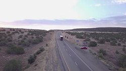 Aerial Drone Footage of Semi-Trucks Rolling Down the Highway Stock Footage