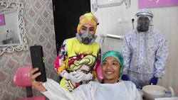 CLEAN : Indonesian dentist boosts patients' mood with colourful PPE News Clip