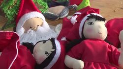 CLEAN : Veiled women make Santa dolls in Gaza Strip News Clip