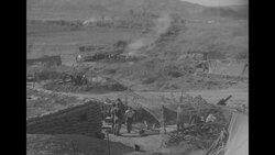 During Korean War, US artillery firing on North Korean positions during Battle of Bloody Ridge in North Korea News Clip