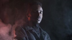 Confident Black Man Posing in Dark Studio Stock Footage