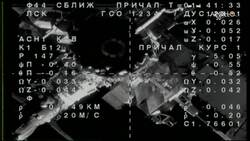 Russian capsule docks with space station Instructional Video