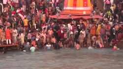 CLEAN : India: Hundreds of thousands plunge in Ganges to celebrate Kumbh Mela News Clip