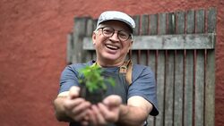 Portrait of Farmer Showing Plants Stock Footage