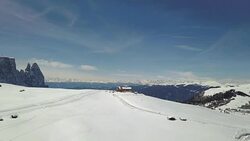 Flying on Seiser Alm with Sciliar mountains in background Stock Footage