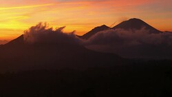 Moving clouds at sunrise around Mount Batur in Bali Stock Footage