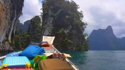 Moving follow boat with Beautiful mountains lake river sky and natural attractions in Ratchaprapha Dam at Khao Sok National Park, Surat Thani Province, Thailand. Stock Footage