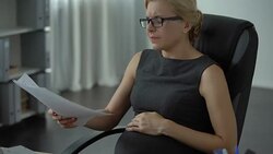 Pregnant office worker feeling strong pain in stomach, risk of misbirth, stress Stock Footage