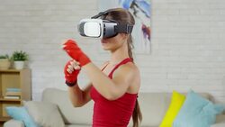 Woman in VR Goggles Practicing Shadowboxing Stock Footage