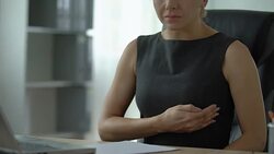Female office worker feeling chest pain, heart arrhythmia, ischemic disease Stock Footage