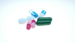 Pharmaceutical pills rotating on white background. Medical tablets Stock Footage