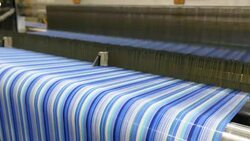 Colorful Threads on a loom in weaving loom machine in textile factory Stock Footage