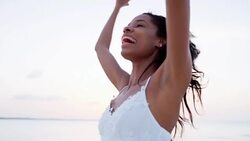 Tropical island living happy ethnic girl on beach Stock Footage