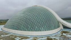 Flying over new modern Georgian Parliament building in Kutaisi, elections Stock Footage