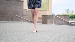 Sexy woman legs in high heels shoes walking in the city urban street. Steadicam Stabilized shot, Female legs in high-heeled shoes, close up Stock Footage